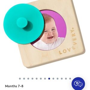Lovevery Wooden Baby Toy with Teal and Natural Wood Colors